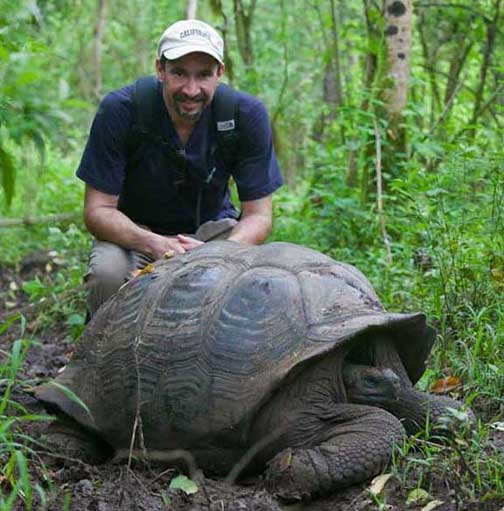 Dr. P with giant Galapagos tortoise in the Galapagos Islands Ecuador reptile