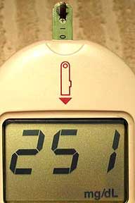 The blood glucose machine showing a reading of 251