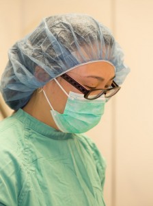 Surgeon gowned and masked for surgery