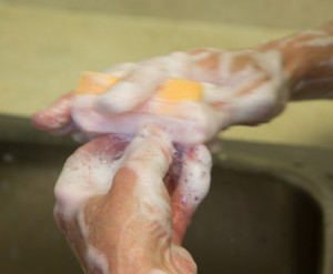 Surgeon scrubbing hands with special soap