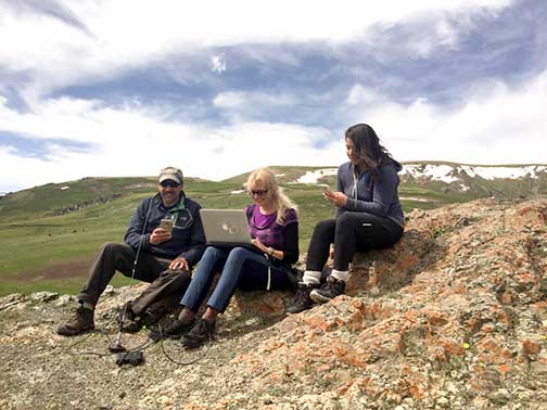 Dr. P and his 2 travel companions trying to get WiFi on top of a mountain in western Mongolia
