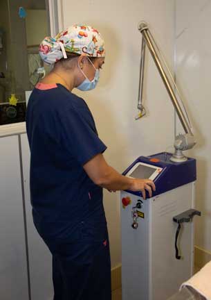 Doctor setting up the laser machine