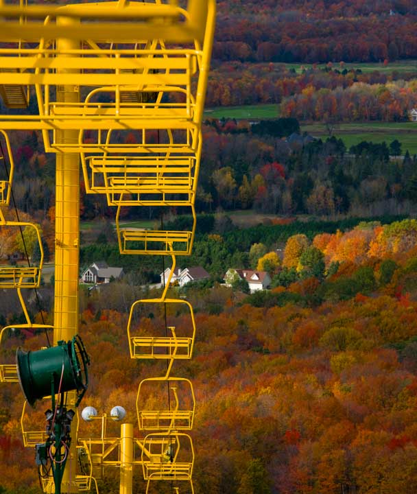 Beautiful fall colors at chairlift at Nub's Nob ski area in Harbor Springs northern Michigan