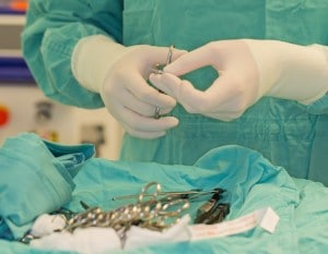Surgeon preparing his sterile instruments for the surgery