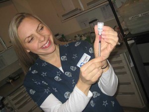 Nurse Showing How To Remove Percorten with a Syringe