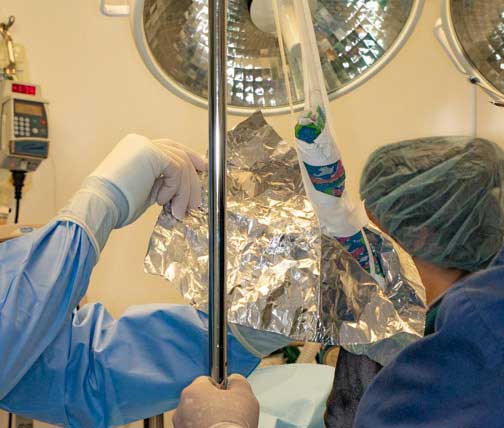 Wrapping foot in aluminum foil