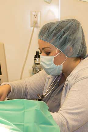 Nurse anesthetist listening to heart